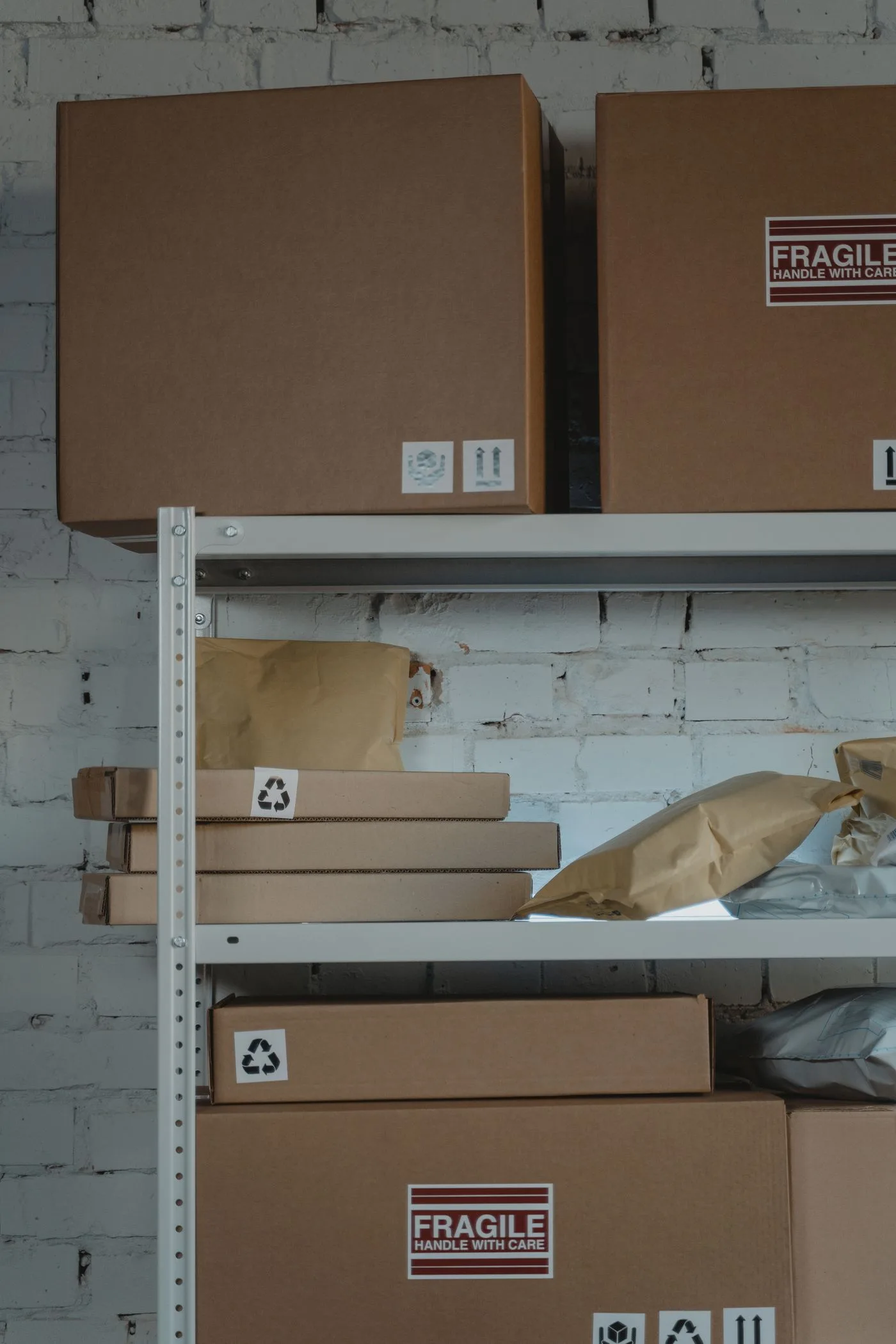 Cardboard parcels arranged on sturdy warehouse shelving